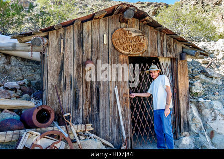 Mr. Werly at the entrance to the Old Eldorado Mine at Techatticup Mine near Route 66 where his family now gives tours of the old mining tunnel Stock Photo