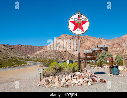 Vintage Texaco sign in desert at Techatticup Mine, a former gold mine + ghost town, near Route 66, stop on road trips in the American southwest. Stock Photo
