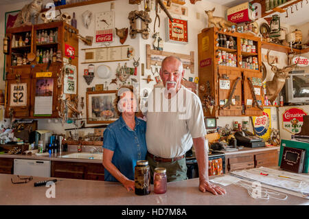 The Werlys, owners of Techatticup Mine in gift shop w/ memorabilia and movie props (alien babies), a fun stop on road trips in the American southwest. Stock Photo