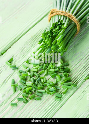 Green onion on the wooden table. Stock Photo