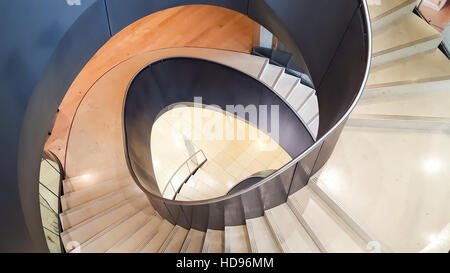 The modern spiral staircase at the Wellcome Trust Collection Museum, London England. Designed by Wilkinson Eyre Architects. Stock Photo