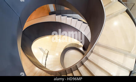 The modern spiral staircase at the Wellcome Trust Collection Museum, London England. Designed by Wilkinson Eyre Architects. Stock Photo