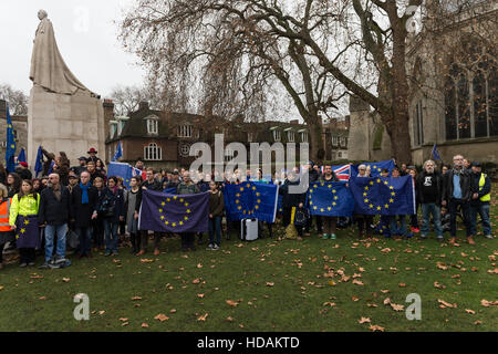 London, UK. 10th December 2016. A large of pro-EU supporters gather in Old Palace Yard to take part in 'The Silent Chain For Europe' event on Human Rights Day. Participants link arms around the George V statue and remain silent in a symbolic act of concern about the existing rights of people living in the UK guaranteed by the European Union membership and threatened by Brexit. Wiktor Szymanowicz/Alamy Live News Stock Photo