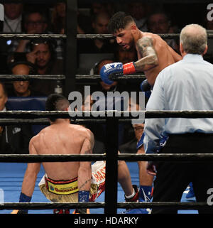 Los Angeles CA. 10th Dec, 2016. (in Blue trunks ) Abner Mares knocks down Jesus Cuellar due the 11th round Friday. Abner Mares took the win by split decision for the WBA featherweight championship title.Photos by Gene Blevins/LA DailyNews/ZumaPress. © Gene Blevins/ZUMA Wire/Alamy Live News Stock Photo