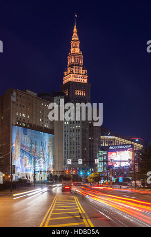 Rush-hour traffic creates light trails heading for the downtown area and the Terminal Tower complex prior to sunrise in Cleveland, Ohio. Stock Photo