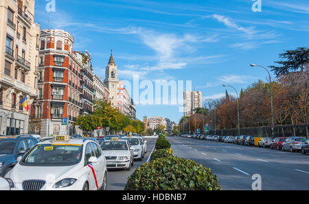 Postcards from Spain.  Taxis in traffic wait for the light on Alica street in Madrid, Spain. Stock Photo