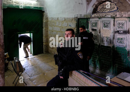 Israeli police stand guard at the Gate of Bani Ghanim or Bab al-Ghawanima one of the three gates located on the north side of the Temple Mount leading to al-Aqsa Mosque compound in the old city of Jerusalem in Israel Stock Photo