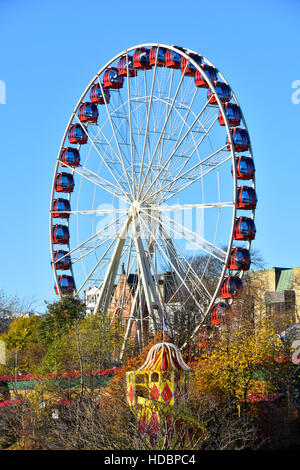 Winter Edinburgh Scottish Christmas ferris big wheel fairground ride on Princes Street Scotland uk in association with the European Christmas Market Stock Photo