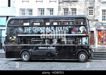Ghost Bus Tours parked in Lawnmarket Edinburgh Scotland uk Scottish refurbished London Routemaster double decker bus painted black with  graphics Stock Photo