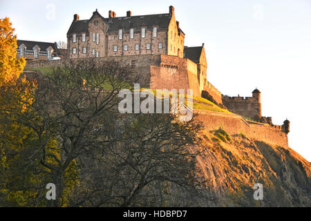 Scottish castle Edinburgh Castle Rock Scotland uk and late afternoon winter sunshine in urban landscape in the town city centre Stock Photo