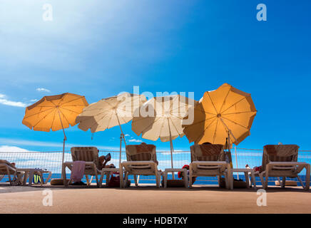 Parasols and sun loungers on a patio, Funchal, Madeira, Portugal Stock Photo