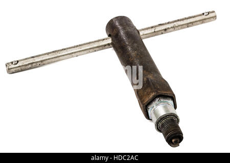Old wrench key and spark plug, isolated on white, with clipping path Stock Photo