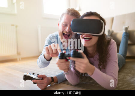 Couple having fun enjoying VR and playing games