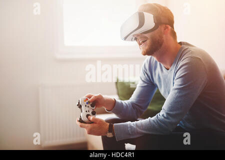 Handsome man enjoying games and  virtual reality Stock Photo