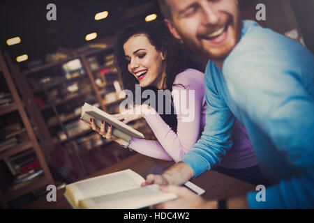 Young university students reading books and studying Stock Photo