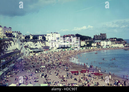 Seafront at Broadstairs, Kent, England. Photo taken in August 1965 and shows a beach full of tourists. Stock Photo