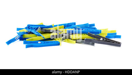 Pile of plastic cloth pegs isolated over white background Stock Photo