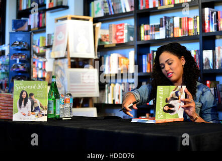 Ayesha Curry signing copies of her first cookbook 'The Seasoned Life: Food, Family, Faith, and the Joy of Eating Well' at Books & Books, Bal Harbour Shops in Miami Beach, Florida.  Featuring: Ayesha Curry Where: Miami Beach, Florida, United States When: 0 Stock Photo