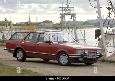 Ford Granada estate car on quayside with fishing boats behind Stock Photo