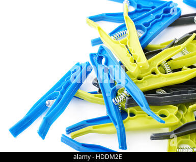 Pile of cloth pegs isolated over white background Stock Photo