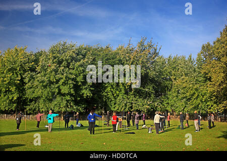 Early morning exercise in Parc de la Villette, in the 19th arrondissement of Paris, France. Stock Photo