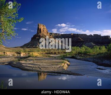 The Bottleneck Peak tower reflects off a stream at the San Rafael Swell June 23, 2014 near Green River, Utah. Stock Photo