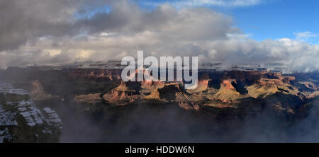 Clouds hang in the sky over the South Rim of the Grand Canyon during winter from the Yaki Point overlook February 20, 2011 near Grand Canyon Village, Arizona. Stock Photo