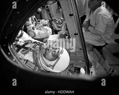 NASA Gemini-Titan 3 prime crew astronauts John Young (left) and Gus Grissom in the Gemini-Titan 3 spacecraft during insertion operations before launch at the Cape Canaveral Air Force Station in 1965 in Cape Canaveral, Florida. Stock Photo