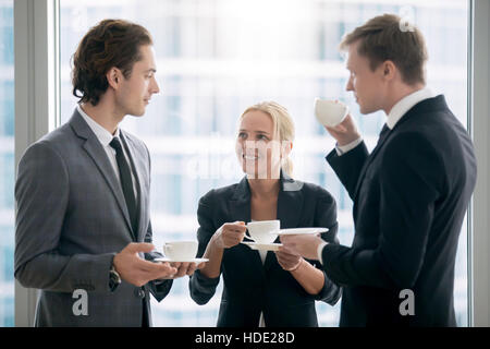 Group of businessmen having tea after meeting Stock Photo