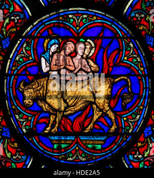 Stained Glass in Notre Dame Cathedral of Paris depicting the Adoration of the Golden Calf, as mentioned in the Old Testament, Exodus. Stock Photo