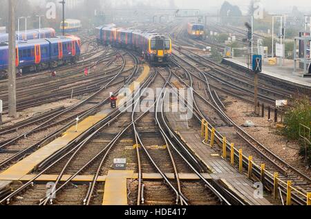 A South West Trains Class 450 train passes through Clapham Junction station in South West London. 450041 Stock Photo