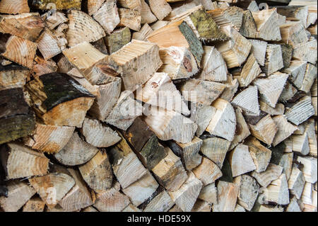 A stack of cut firewood logs ready to burn, Stock Photo