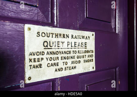 Southern Railway 'Quiet Please' sign on a purple door. Stock Photo