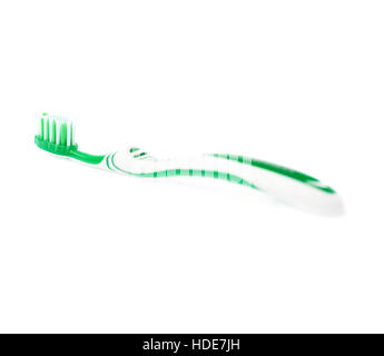 Green toothbrush isolated over white background Stock Photo