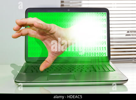 Hand on a computer Stock Photo