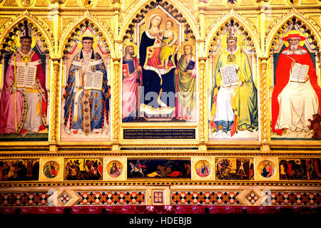 The main altar in Basilica Santa Croce Florence featuring Virgin and Saints Stock Photo