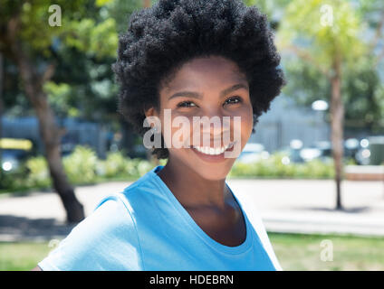 Portrait of an african american girl outdoor in a park in the summer Stock Photo