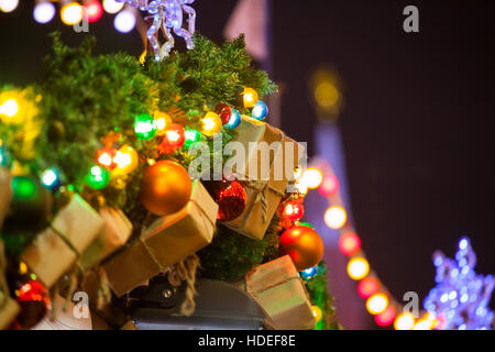 Xmas decoration of fir branches, gifts and baubles Stock Photo