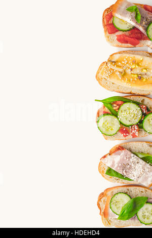 Different tartines on the white background vertical Stock Photo