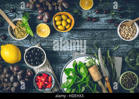 Concept of Mediterranean cuisine. Different fruit , herbs and appetizers on the wooden table horizontal Stock Photo