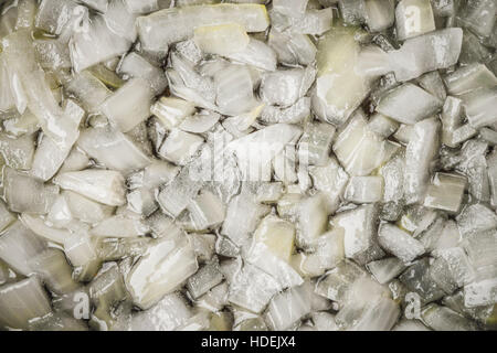 Sliced onion with olive oil background close-up Stock Photo