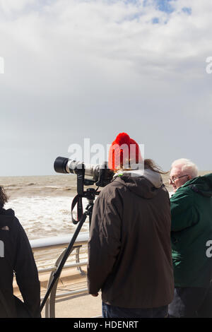 Photographer on the seafront at the Blackpool Airshow 2016, waiting for the next display aircraft to arrive. Stock Photo