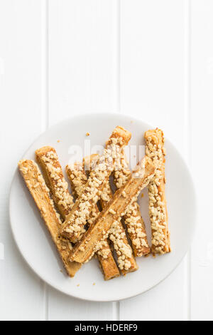 Crispy bread sticks with cheese on plate. Stock Photo