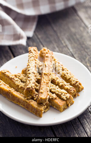 Crispy bread sticks with cheese on plate. Stock Photo