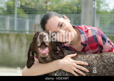 shelter keeper loves her residents Stock Photo