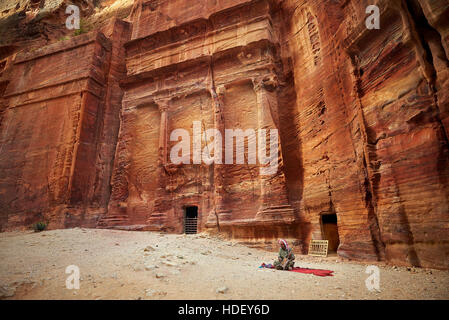 2016-04-27 An old man playing traditional Bedouin Rababa string musical instruments near tomb 67. Ancient city of Petra, Jordan Stock Photo