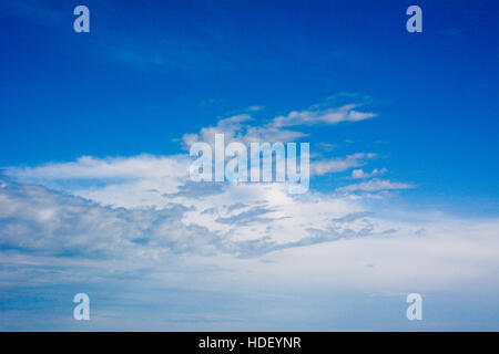 Patterned white clouds in a blue sky. Stock Photo