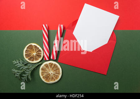 Opened red envelope with blank paper sheet included. Top view. Flat lay. Stock Photo