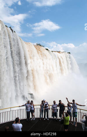 Iguazu: people in front of the spectacular Iguazu Falls, one of the most important tourist attractions of Latin America Stock Photo