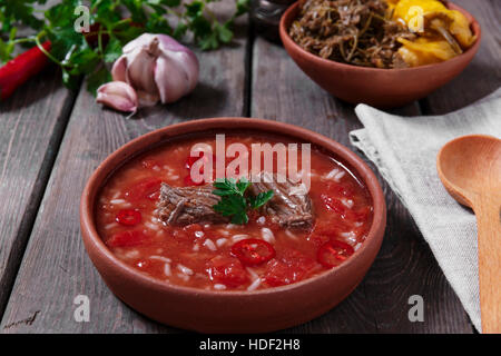 Traditional Georgian soup Kharcho with meat and rice in ceramic ware Stock Photo